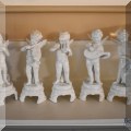 P06. Set of white porcelain cherubs with musical instruments. 